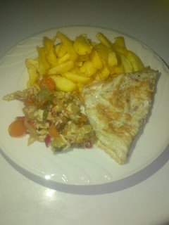 A picture of Potatoes, omelette and vegetables sauce.