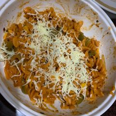 A picture of Red sauce spiral pasta.