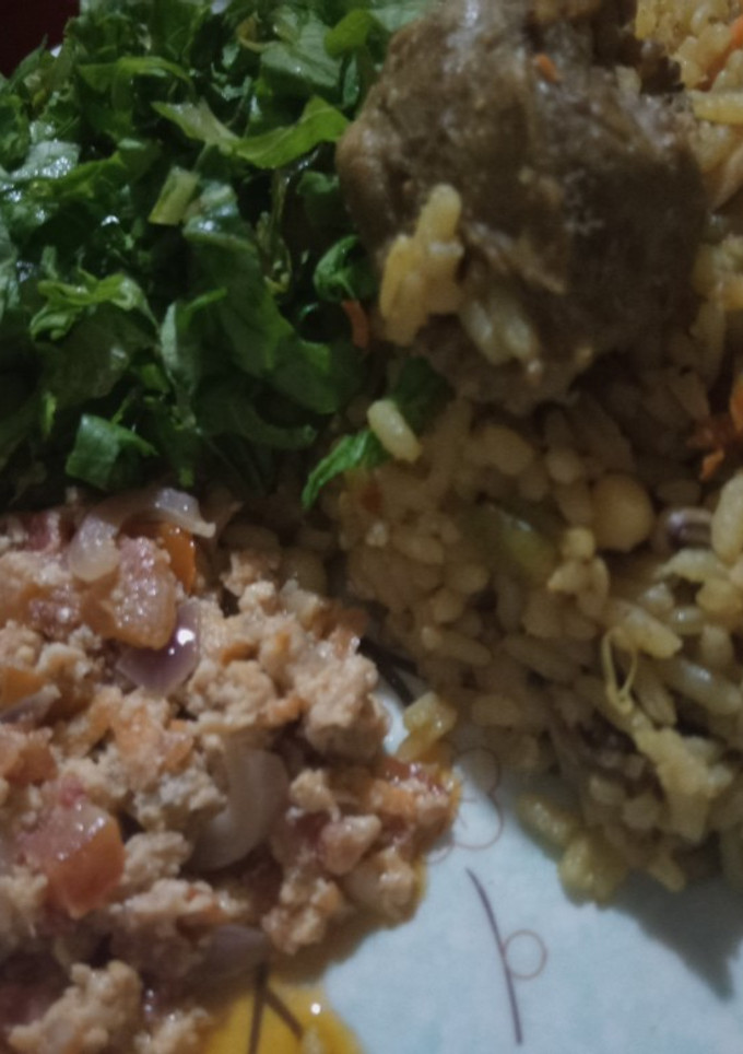 A picture of Rice and Beans jollof with egg source.