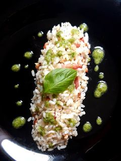Una foto de Arroz trufado con salsa pesto