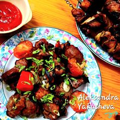 A picture of Pork skewers marinated in pomegranate juice.