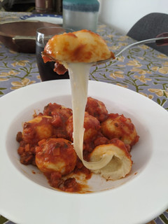 Una foto de Ñoquis rellenos de queso