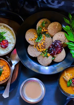 A picture of Multigrain Idli, Garlic Chutney, Coconut Chutney, Sambhar.