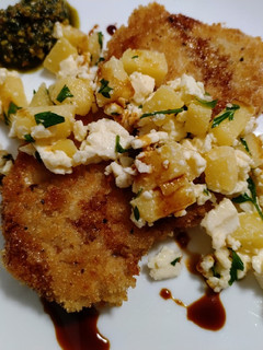 A picture of Crispy pork chops with apple, feta and balsamic.