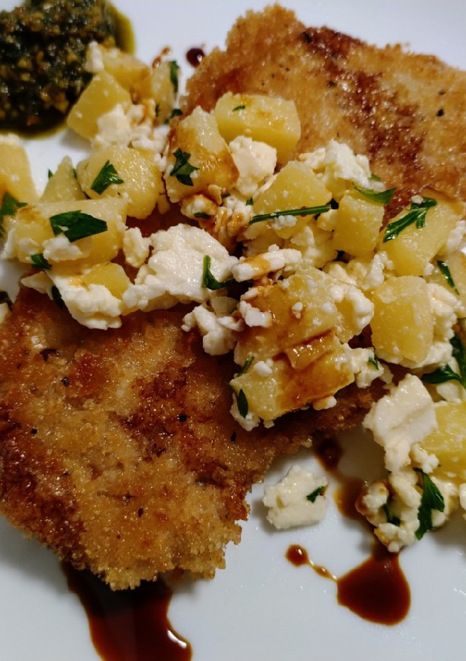 A picture of Crispy pork chops with apple, feta and balsamic.