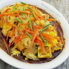 A picture of Tofu Omelette with Peanut Sauce.
