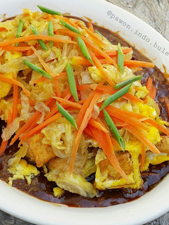 A picture of Tofu Omelette with Peanut Sauce.