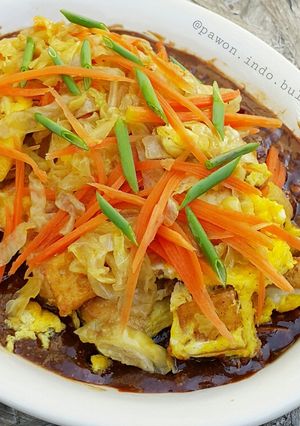 A picture of Tofu Omelette with Peanut Sauce.