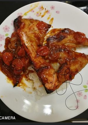 A picture of Salmon Fish Head With Whisky Tomato And Onion Sauce.