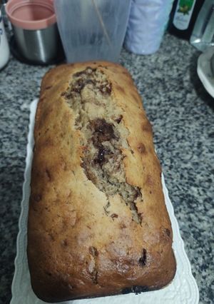 Una foto de Budín de banana con chocolate 🍫 o con frutos secos 🫐