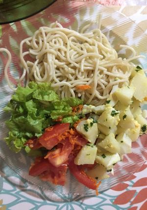 A picture of Boiled Potatoes Provençal Style with Tomato, Carrot, and Lettuce.