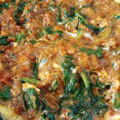 A picture of Scrambled Eggs with Spinach.