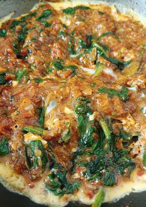 A picture of Scrambled Eggs with Spinach.