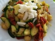 Una foto de gnocchi con calabacin