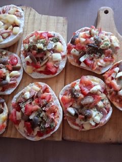 Una foto de Pizza en hallulla