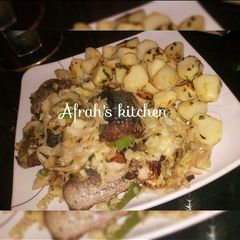 Baked potatoes and oven fish with cabbage sauce A picture of Baked potatoes and oven fish with cabbage sauce.