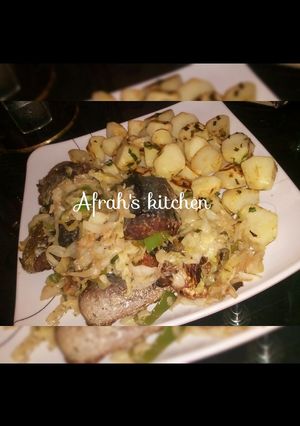 A picture of Baked potatoes and oven fish with cabbage sauce.