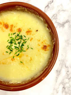 Una foto de Puré de patatas con queso gratinado