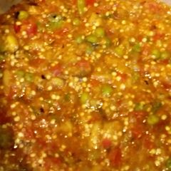 A picture of Roasted Aubergine with peas.