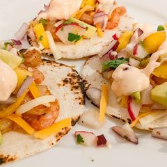 A picture of Shrimp tacos with Mango Radish Salsa.