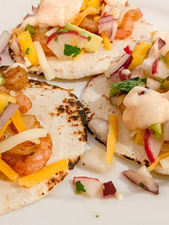A picture of Shrimp tacos with Mango Radish Salsa.