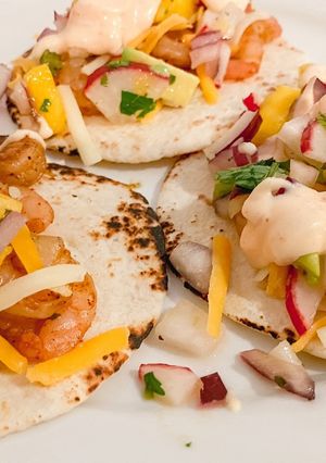 A picture of Shrimp tacos with Mango Radish Salsa.