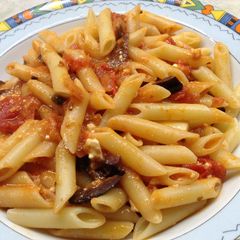 A picture of Pasta with cherry tomatoes, olives and feta cheese!.