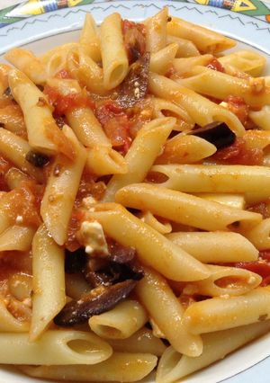 A picture of Pasta with cherry tomatoes, olives and feta cheese!.