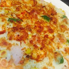 A picture of Tandoori farm fresh pizza.