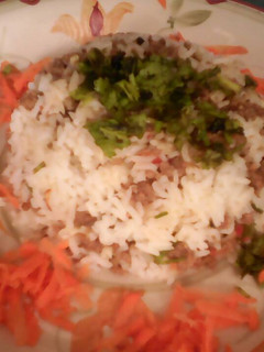 Una foto de Arroz capeado con carne y queso