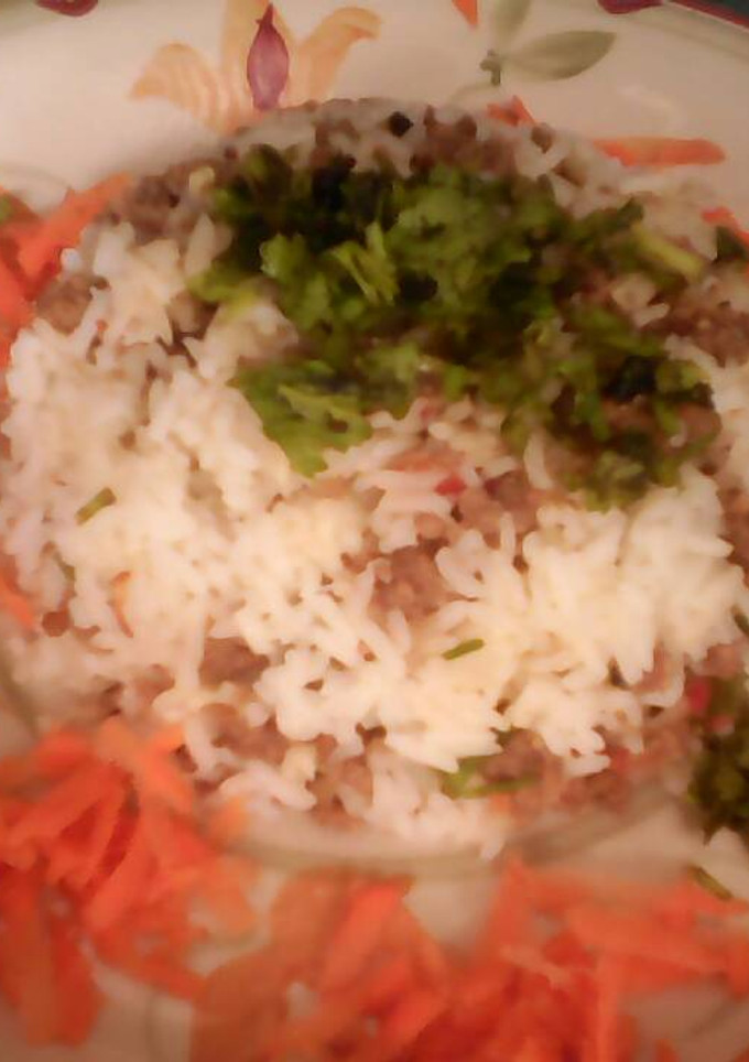 Una foto de Arroz capeado con carne y queso