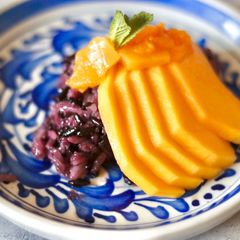 Sweet sticky rice with mango and mango coulis A picture of Sweet sticky rice with mango and mango coulis.