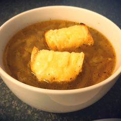 A picture of French Onion Soup with French Brie Croutons.