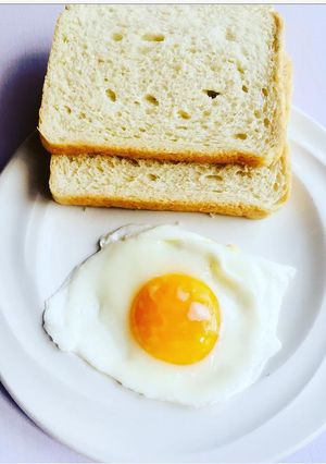 A picture of Pouch egg served with bread.