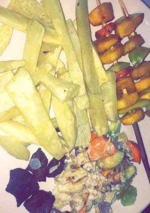 A picture of Sweet potatoes wit stick plantain nd scramble vege egg.