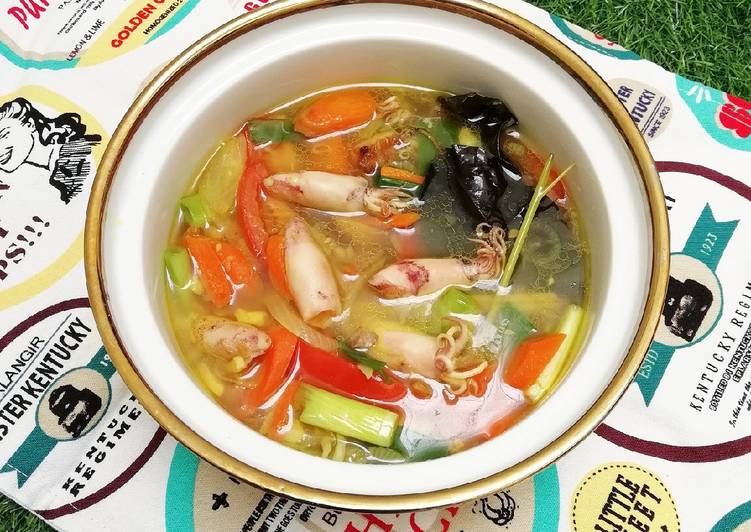 Bagaimana Menyiapkan Cumi Kuah Kuning yang Menggugah Selera