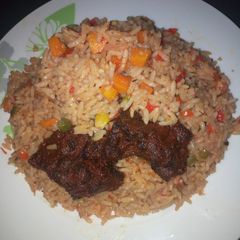 A picture of Veggies rice and peppered meat.