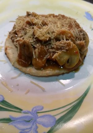 Una foto de Arepa de Pernil y champiñones