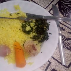A picture of Tumeric rice with fried vegetables.
