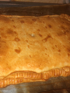 Una foto de Empanada de pollo y puerros