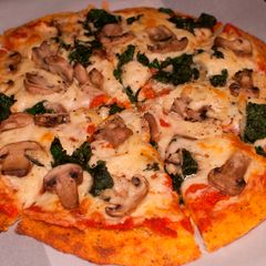 A picture of Polenta Pizza with Mushrooms and Spinach.