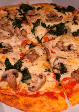 A picture of Polenta Pizza with Mushrooms and Spinach.