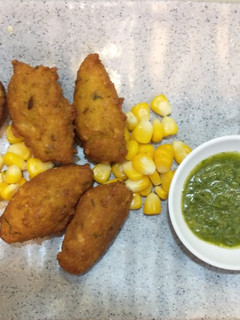 A picture of Corn pakodas (fritters) and appe.