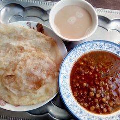 A picture of Puri with Channay (Desi Nashta).