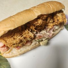 A picture of Brad's lobster roll with fried pacific oysters.
