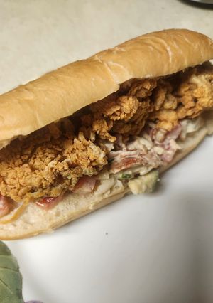 A picture of Brad's lobster roll with fried pacific oysters.