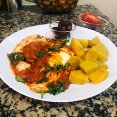 A picture of Eggs in tomato sauce.