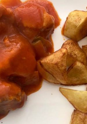 Una foto de Conejo con tomate