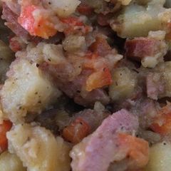 A picture of Potatoes and sausage.