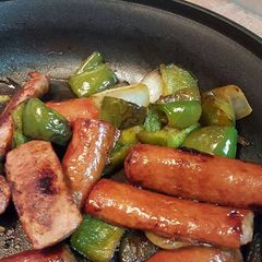 A picture of Sausage, peppers, and onions.